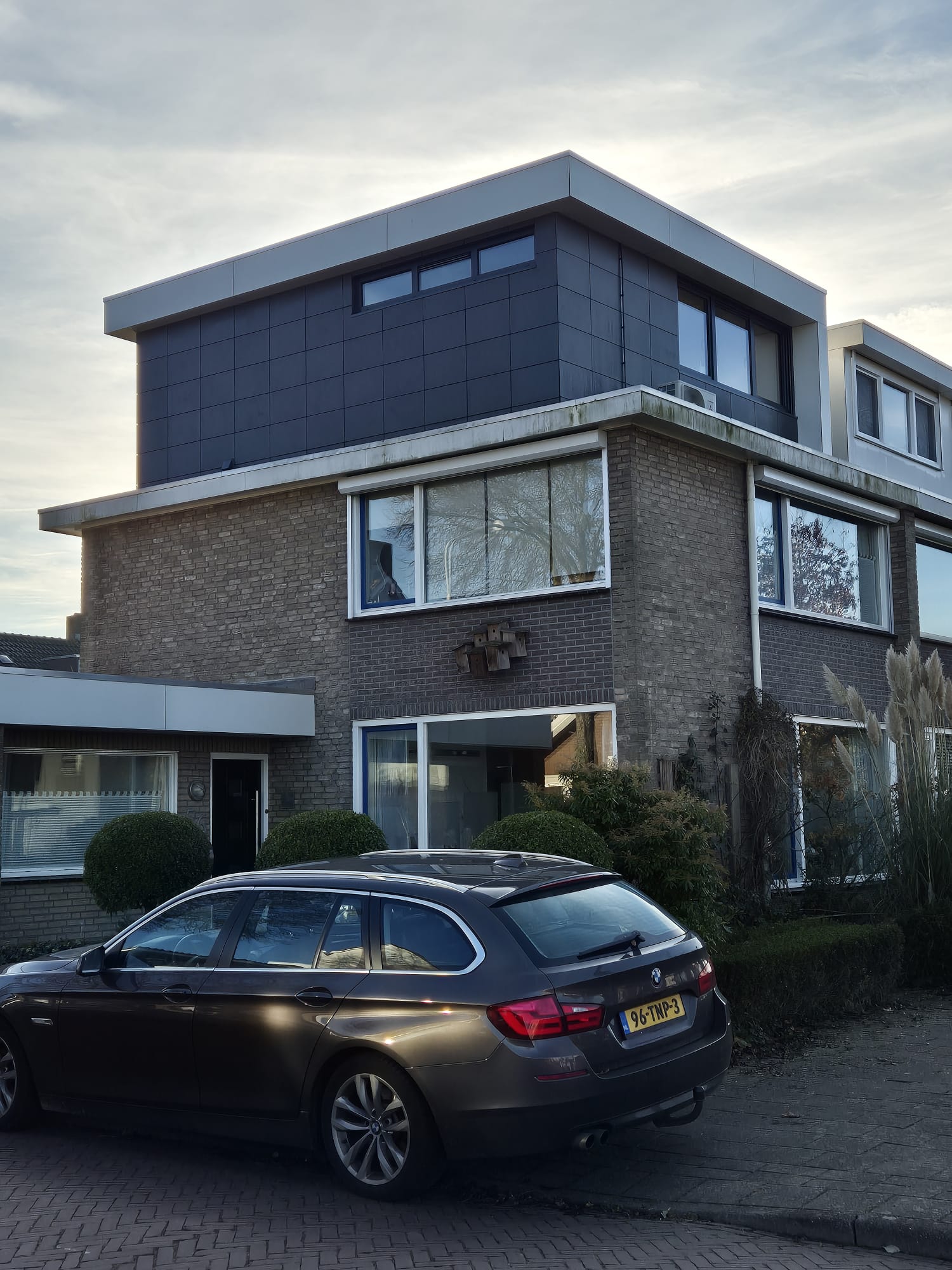 Home extension and dakkapel with modern black panel cladding in Eindhoven by Construxx